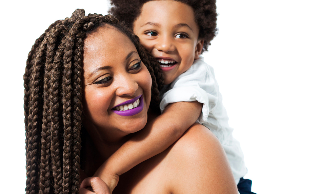 Black mother hugging son- maternal mental health, labor doula, postpartum doula